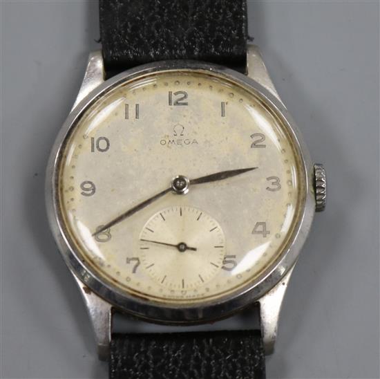 A gentlemans late 1940s stainless steel Omega manual wind wrist watch, movement c. 30T2 PC, on later associated strap.